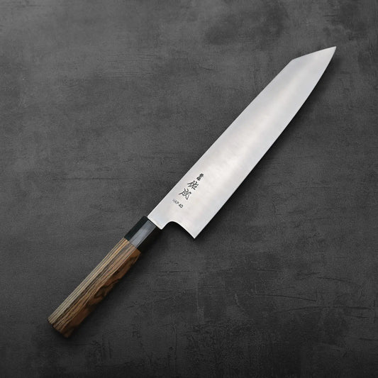 Kiritsuke gyuto with a wooden handle and silver blade, highlighting its distinct length and shape.