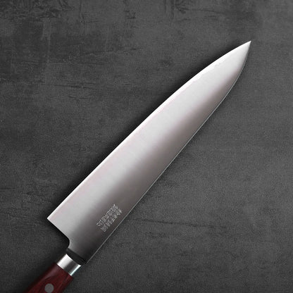 A gyuto with a wood handle. The blade features a polished finish and measures approximately 210mm in length.
