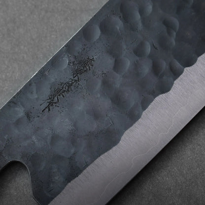 Nakiri with hammered finish and engraved markings, shown in a close-up highlighting blade details.