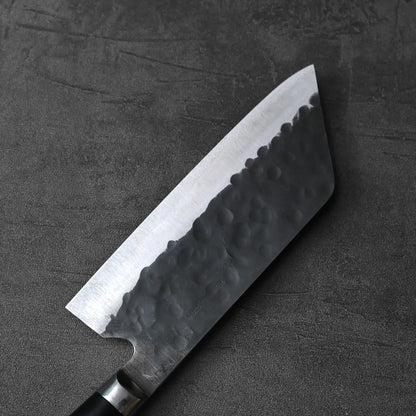 Close-up of a bunka knife showing its tall, angular blade and distinct profile.