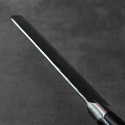 Close-up of a bunka blade, showing its tall 175x60mm profile and edge details.