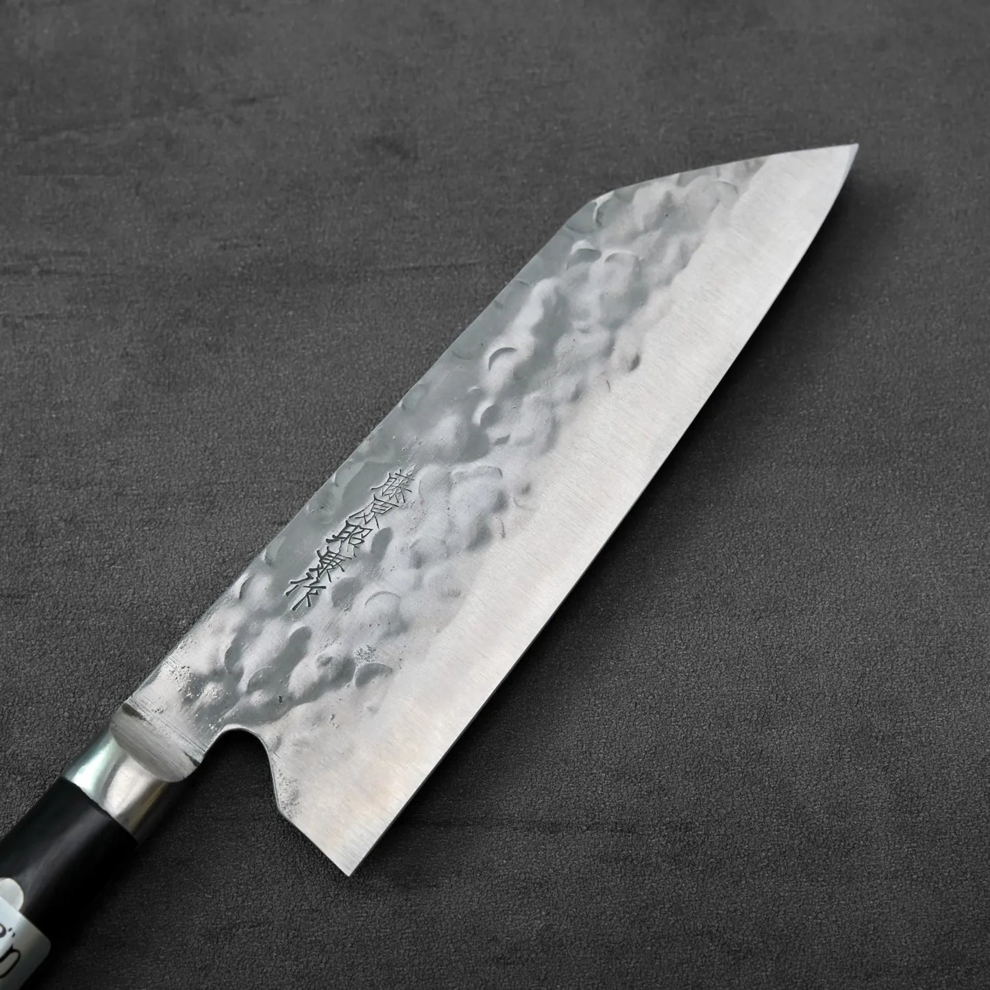 Santoku with a 165mm blade displayed, showing its shape and size.