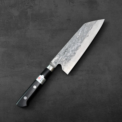 Teruyasu Fujiwara maboroshi santoku 165mm with a hammered blade displayed, highlighting the distinct texture and shape of the metal.