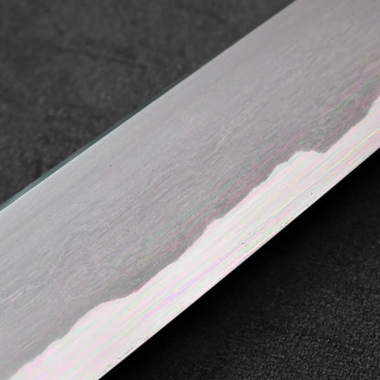 Close-up of sujihiki blade featuring a wavy pattern.