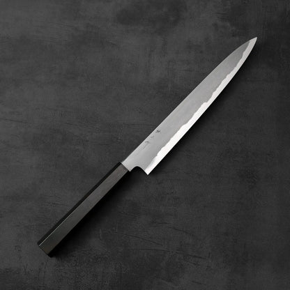 A Tetsujin kasumi aogami#2 sujihiki 240mm with a dark handle is shown, displaying its length and slim profile.