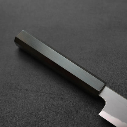 Sujihiki knife with a dark handle, close-up view highlighting the contours and handle details.