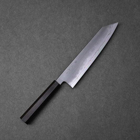 A kiritsuke gyuto knife with a kasumi finish, ginsan stainless steel blade, and an octagonal ebony handle.