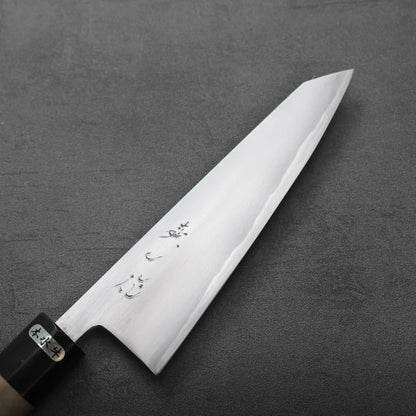Honesuki with a pointed tip, engraved blade, and dark ferrule.