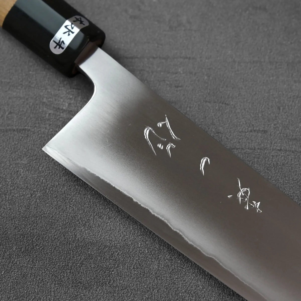Sujihiki 270mm with a dark wooden handle, a bolster, and engraved Japanese kanji.