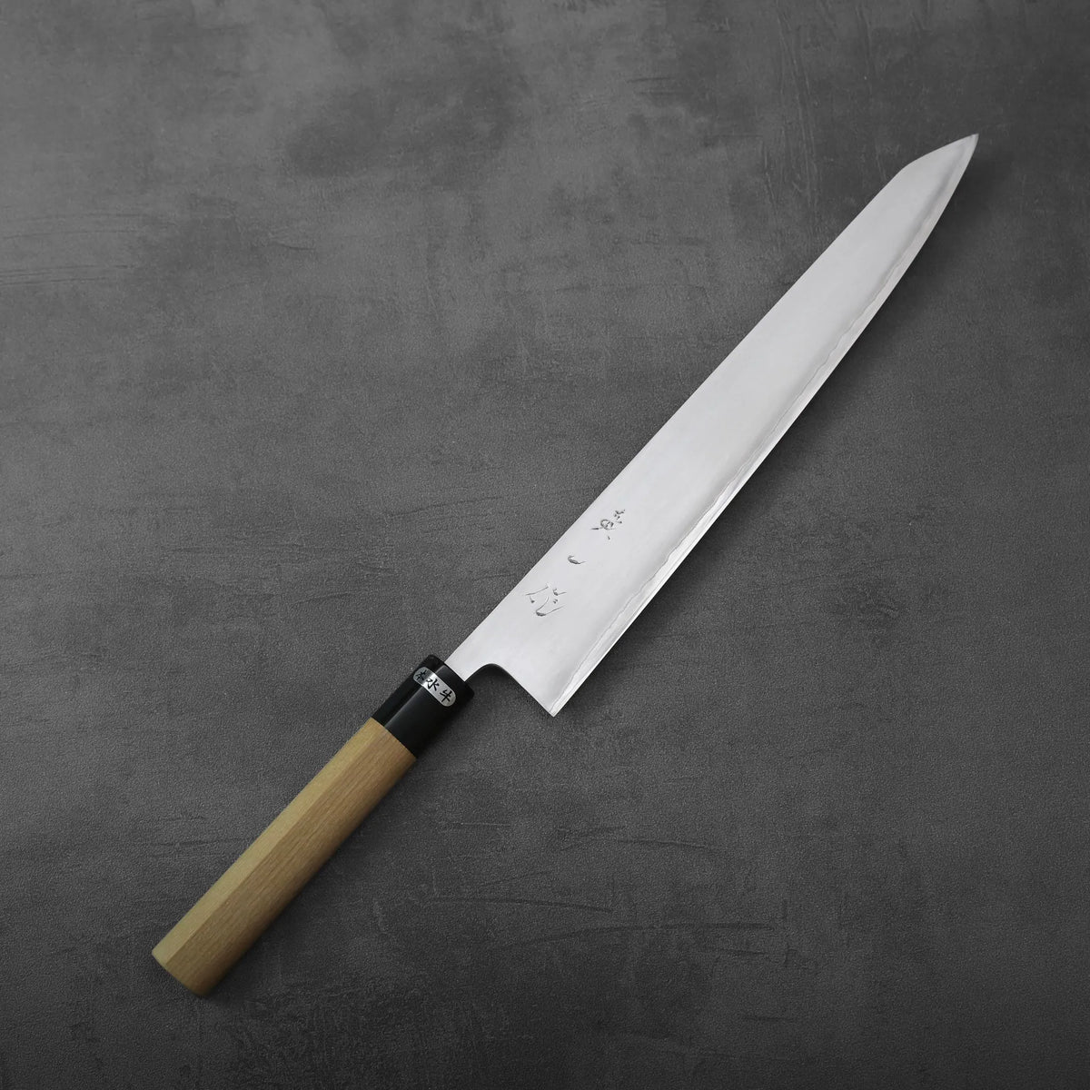 Sujihiki 270mm with a long, tapered blade, black ferrule, and light-colored wooden handle.