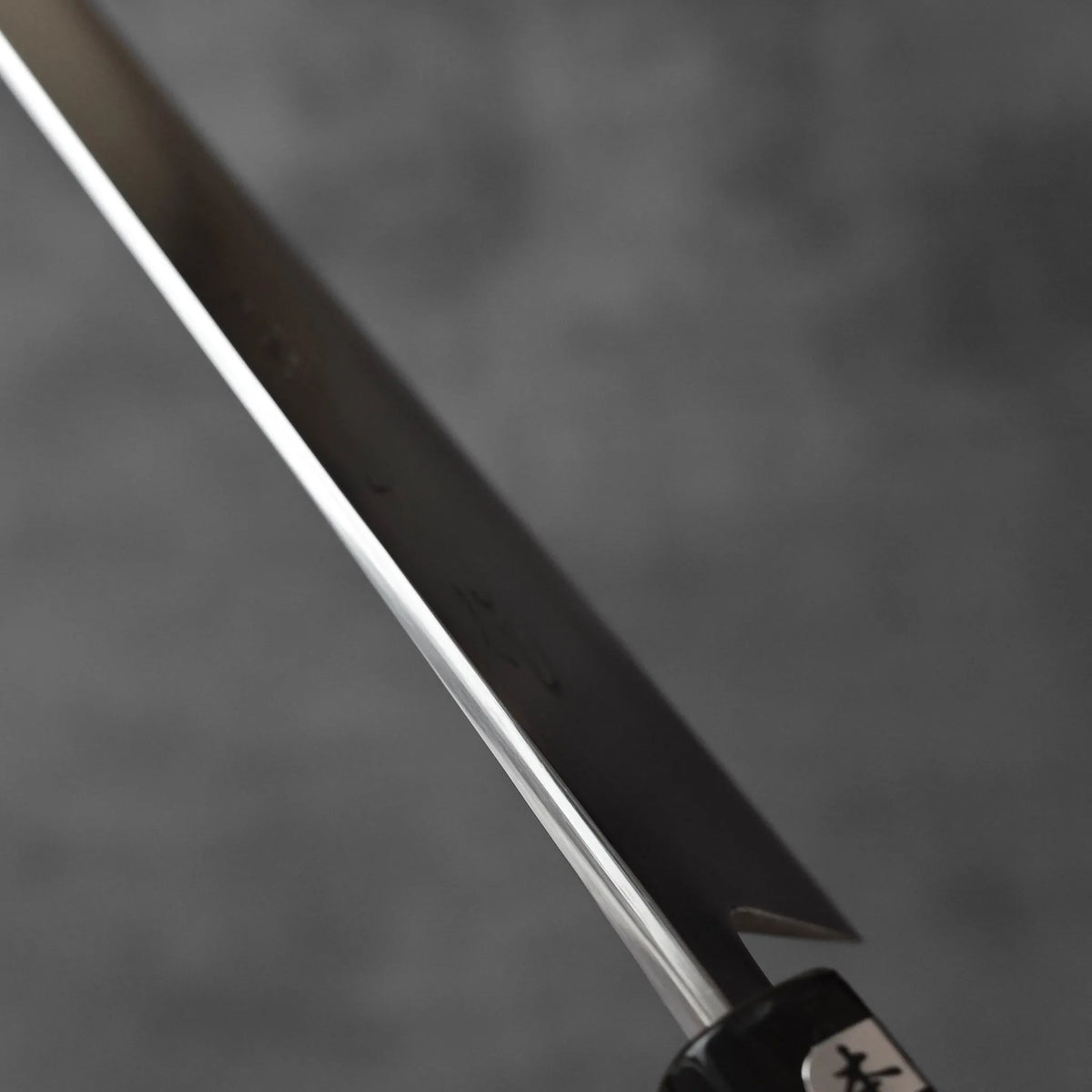 Sujihiki 270mm with a long, thin blade and a dark handle featuring a small Japanese label.