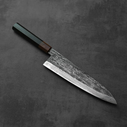 Gyuto with a dark handle, featuring an extra tall 240x58mm blade.