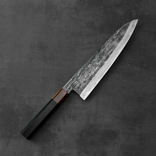 A Yamada rentetsu aogami#1 extra tall gyuto 240x58mm with a dark handle, extra tall at 58mm and 240mm long, is shown in close-up detail.