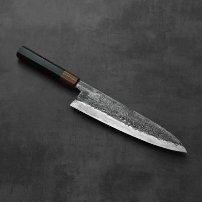 A gyuto with a tall, broad blade measuring 240x55mm is positioned for display.