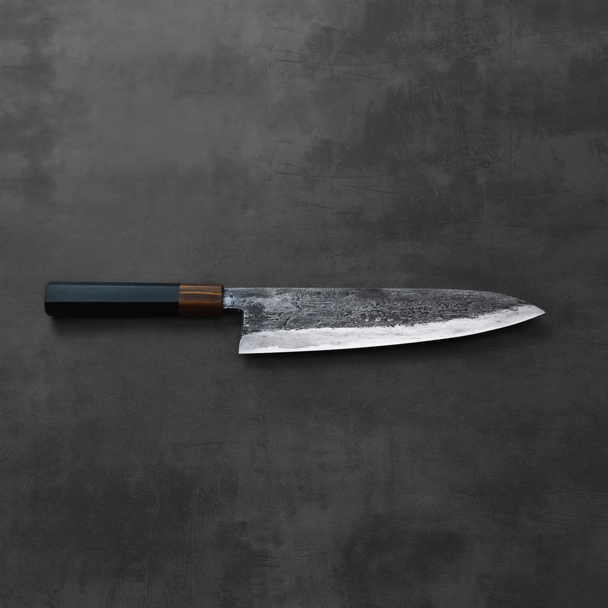 Gyuto with a dark handle, featuring a tall 240x55mm blade, highlighted with clear visual details.