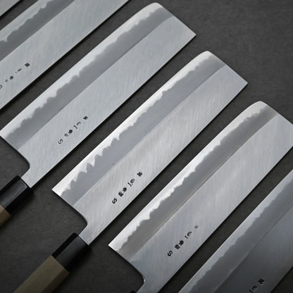 Set of four nakiri knives with engraved kanjis on the back side