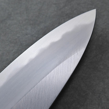 Close-up of a shiny, silver knife blade featuring a visible wavy pattern along the edge against a dark, textured background, highlighting its elegant craftsmanship.
