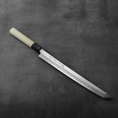 Sakimaru sujihiki with saya, blade is long and gently curved, accompanied by its wooden sheath.