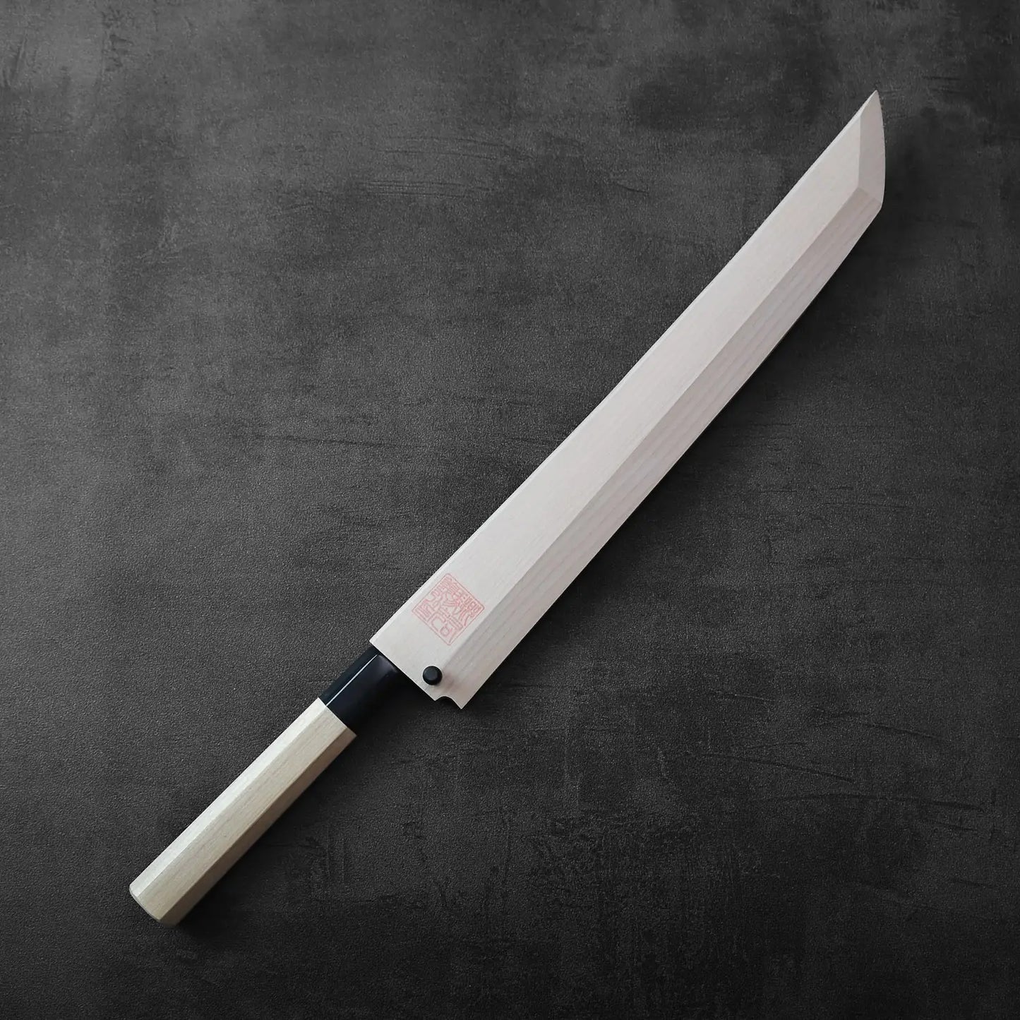 Sakimaru sujihiki with a long single-edged blade and saya, showcasing its distinct profile and length.
