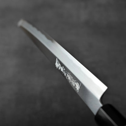 Close-up of a sakimaru sujihiki with shirogami#1 steel, 270mm blade and saya, crafted in Sakai, Japan.