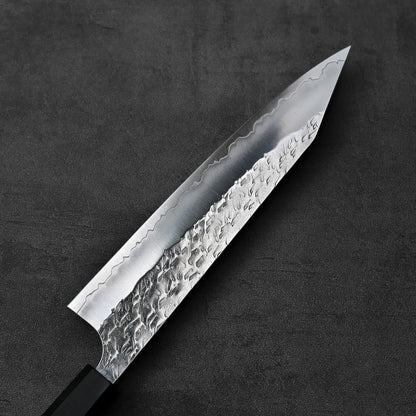 Close-up of a kiritsuke gyuto blade highlighting its 210mm length and detailed finishing.