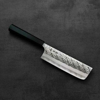 Nakiri with a black handle, its blade reflecting subtle light, positioned for a clear side view.