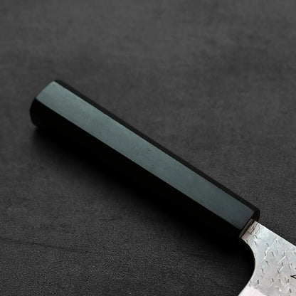 Nakiri with a black handle and visible blade edge, shown in close-up with no background details.