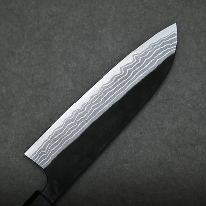 A close-up of a damascus santoku knife with a patterned Damascus steel blade, showing distinct wavy lines, set against a dark, textured background.