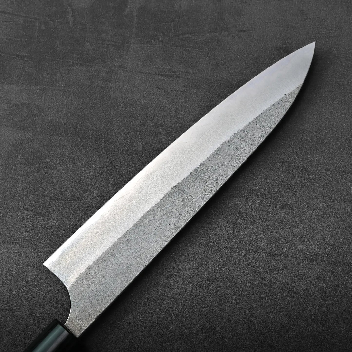 Close-up of a gyuto with a shiny blade.