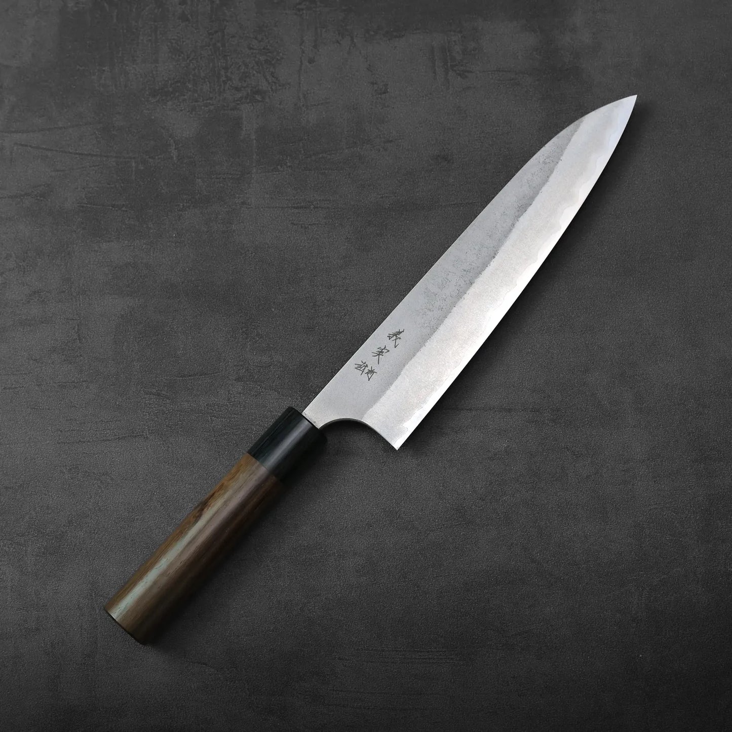 Yoshimi Kato nashiji AS gyuto 210mm with a wooden handle featuring a textured pattern along the blade.