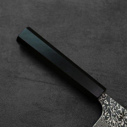 Kiritsuke gyuto with black hexagonal handle and patterned blade.