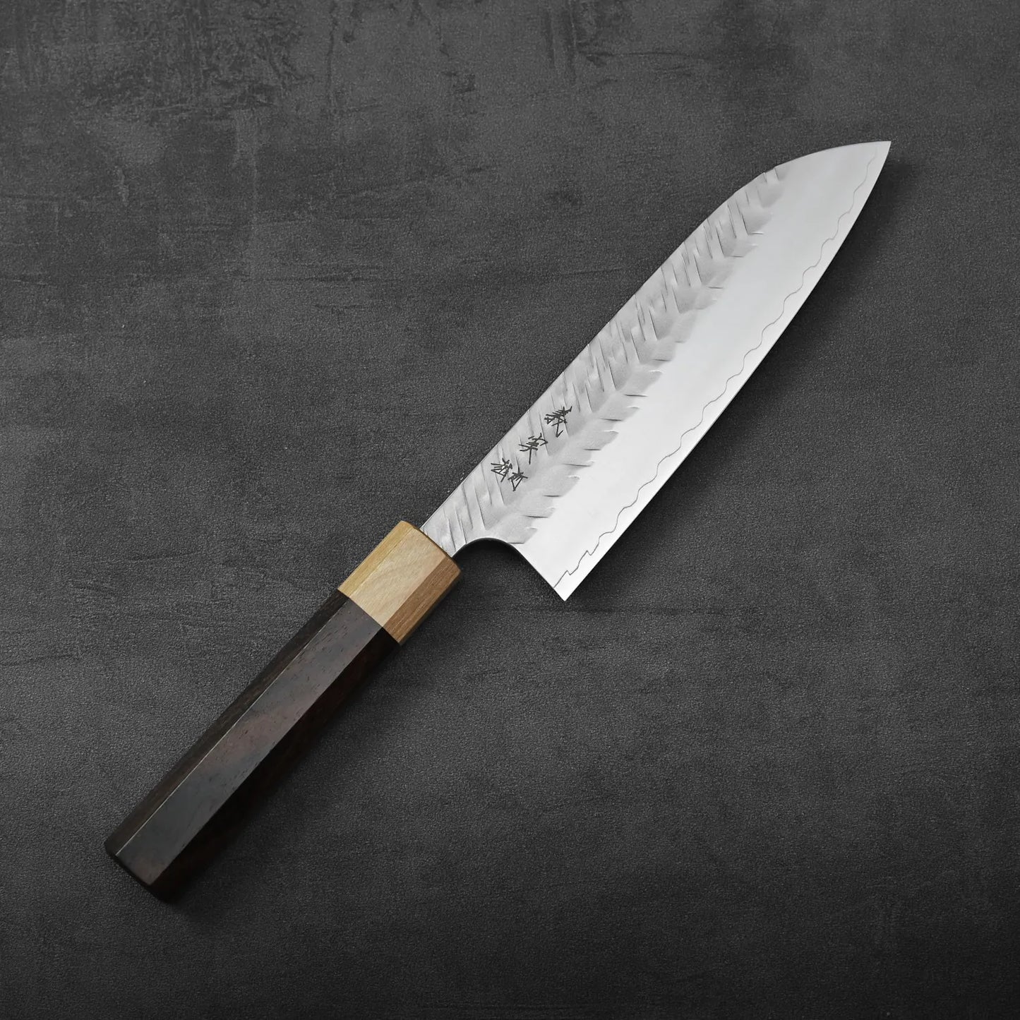 Yoshimi Kato tsuchime STRIX santoku 170mm with a hammered finish and wooden handle, blade measuring 170mm.