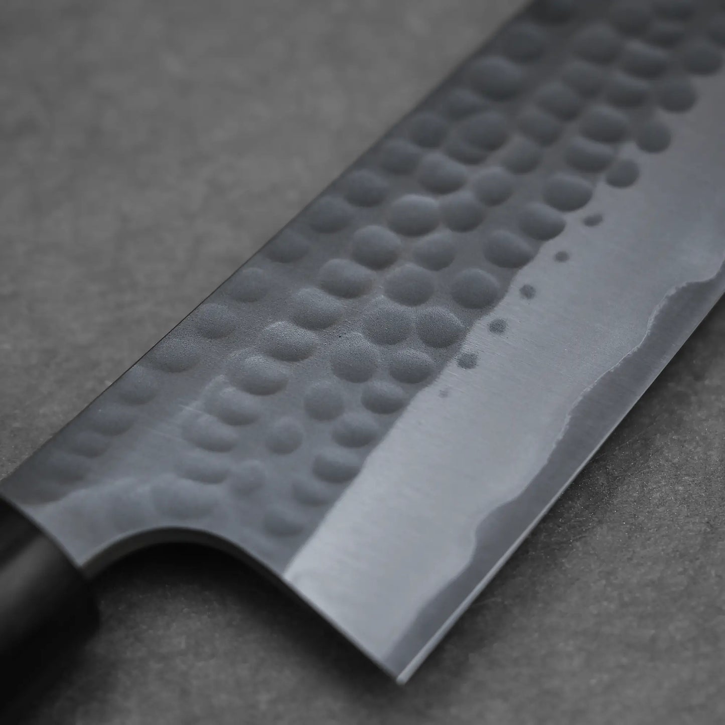 Close-up shot of the tsuchime finish on 170mm Anryu knife tsuchime aogami#2 santoku