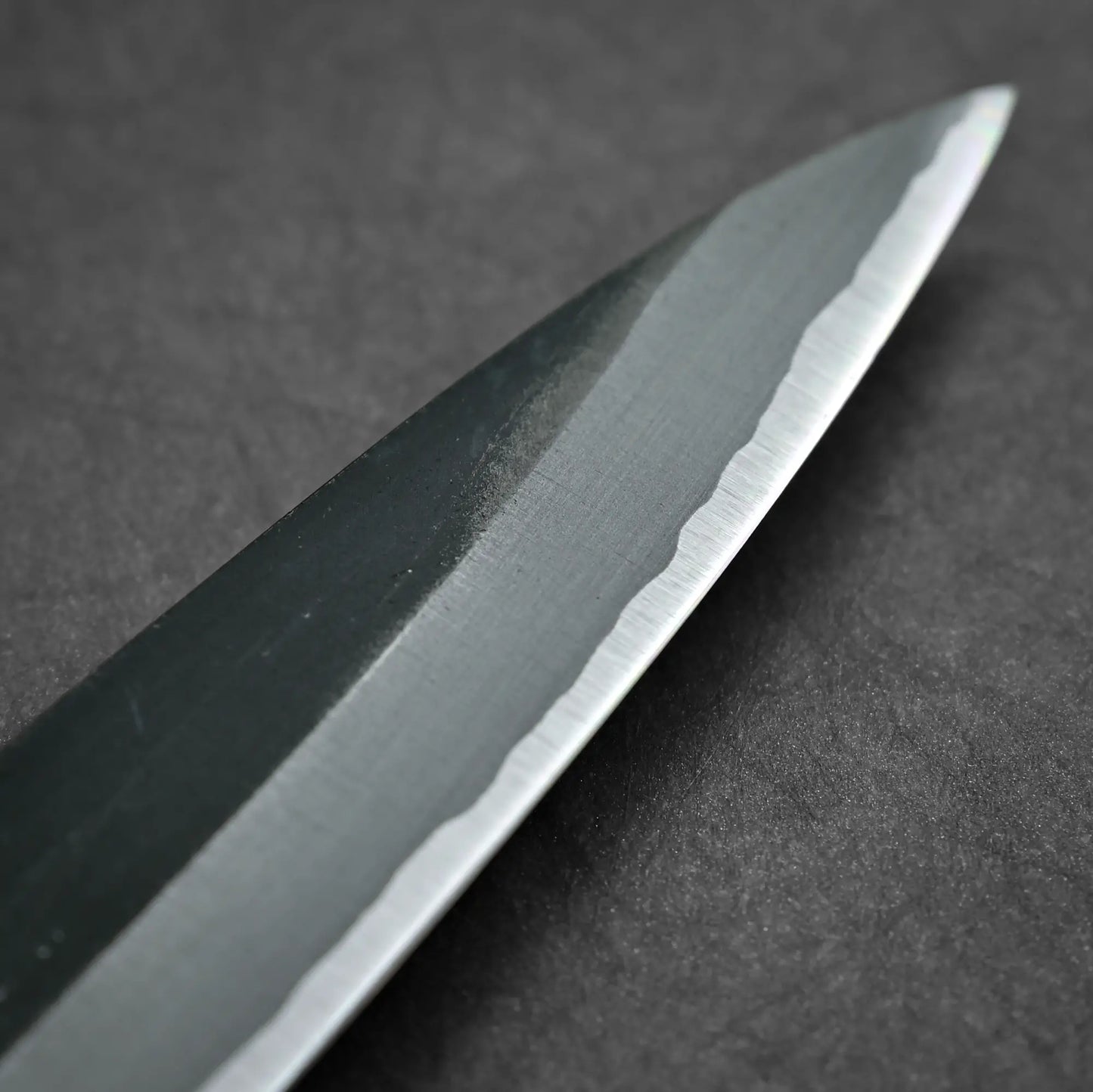 Close-up of 150mm Hatsukokoro Aosagi kurouchi aogami#2 petty knife showing tip area