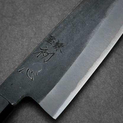 Close-up shot of 180mm Hatsukokoro Aosagi kurouchi aogami#2 santoku knife showing kanji