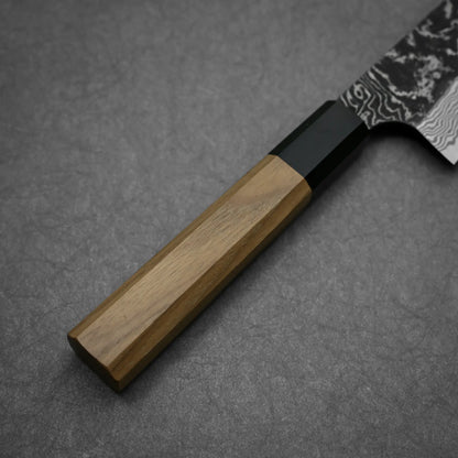 Close-up shot of the handle of Nigara knife SLD kurouchi damascus 210mm gyuto