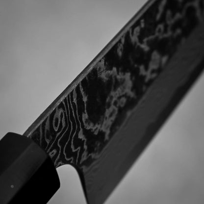 Close-up shot of the spine of Nigara knife SLD kurouchi damascus 210mm gyuto