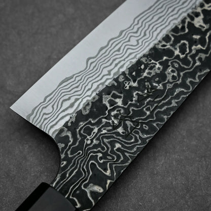 Close-up shot of the back side of Nigara knife SLD kurouchi damascus 210mm gyuto