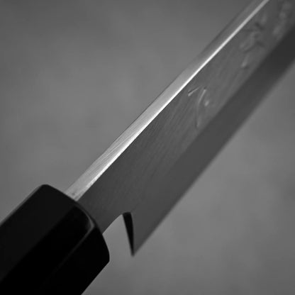 Close-up shot of the spine of 300mm Hatsukokoro Shirasagi ginsan yanagiba knife