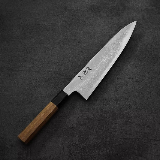 Top down view of Hatsukokoro Komorebi damascus aogami#1 gyuto knife
