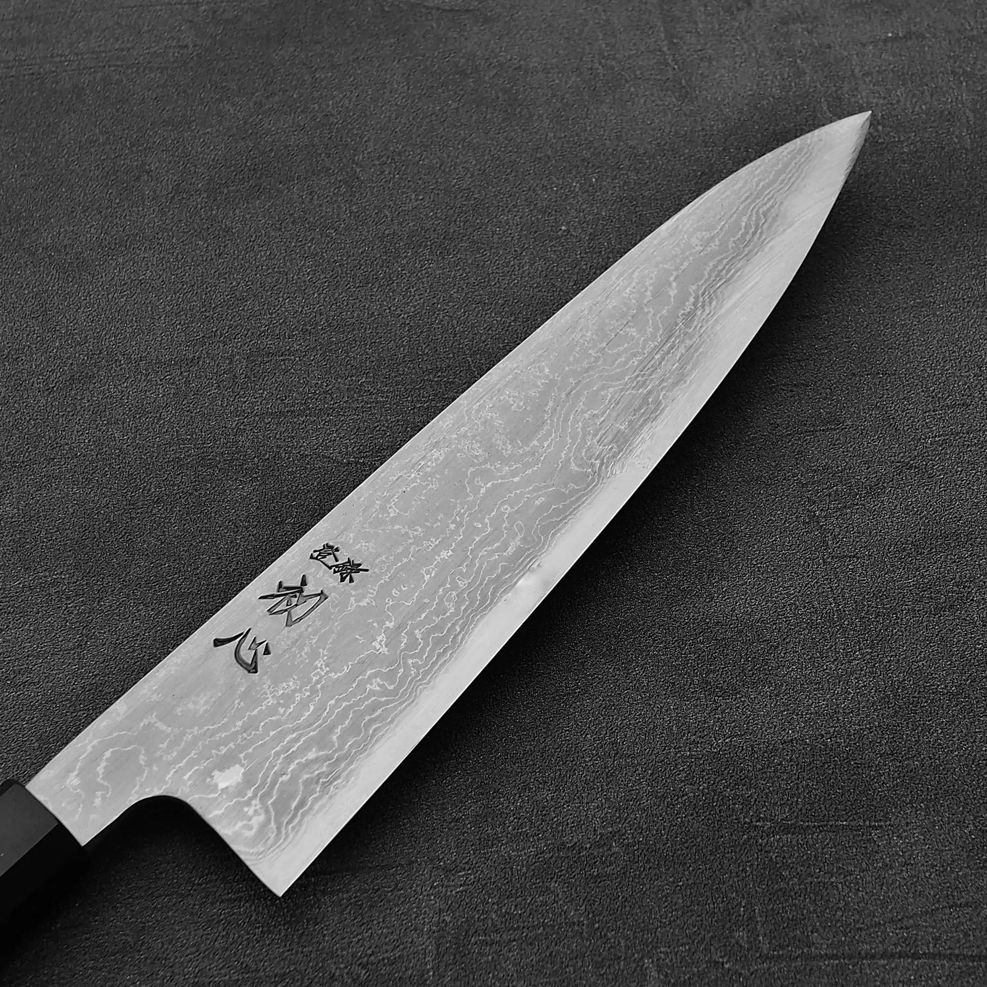 Close up view of Hatsukokoro Komorebi damascus aogami#1 gyuto knife