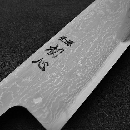 Close up view of the kanji of Hatsukokoro Komorebi damascus aogami#1 gyuto knife