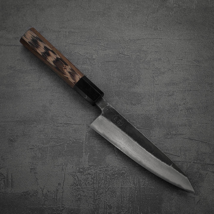 Top down view of Hatsukokoro Kumokage kurouchi damascus aogami#2 honesuki knife