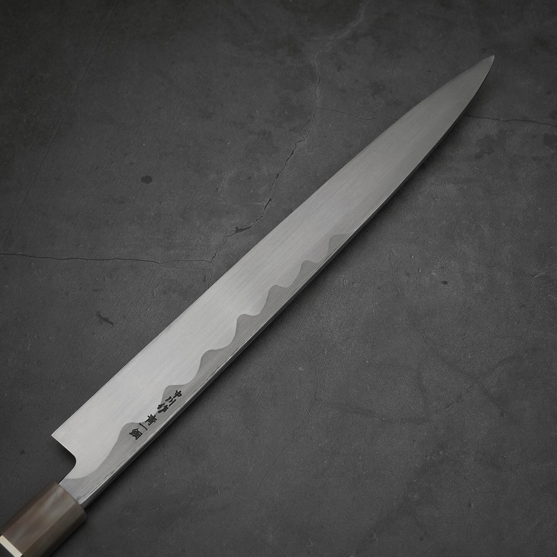 Close up view of the back side of Nakagawa 300mm yanagiba with aogami#1 steel. This sushi knife is sharpened by Morihiro hamono. 
