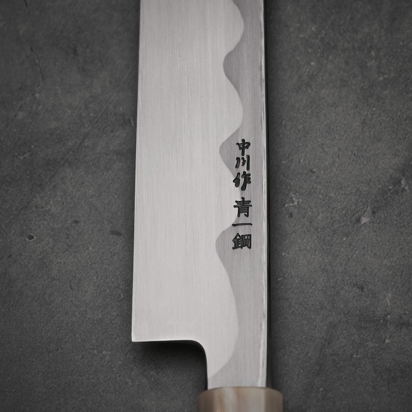 Close up view of the kanji of Nakagawa 300mm yanagiba with aogami#1 steel. This sushi knife is sharpened by Morihiro hamono. 