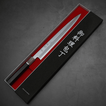 Top down view of Nakagawa 300mm yanagiba with aogami#1 steel. This sushi knife is sharpened by Morihiro hamono. Knife is inside its box.