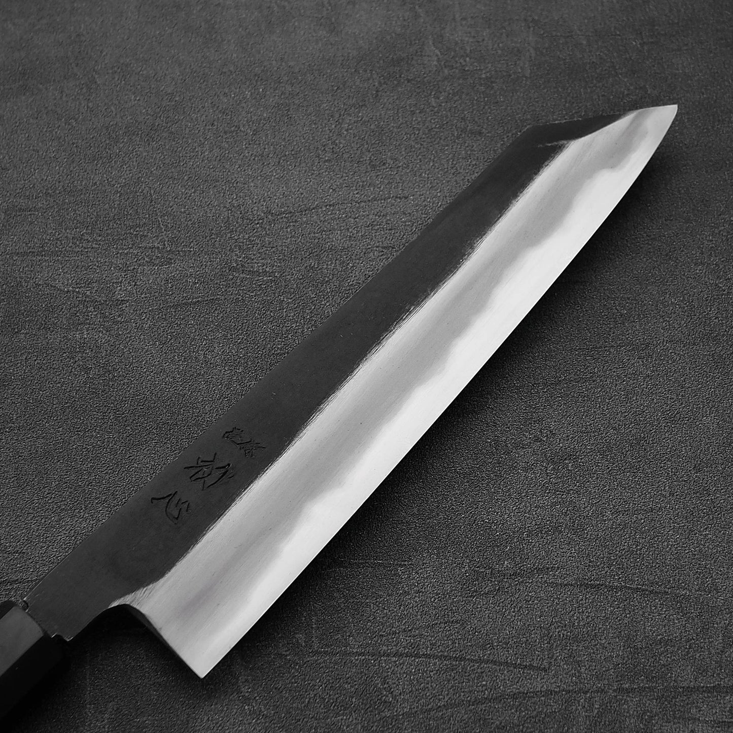 Close up view of the front blade of Hatsukokoro Yoake kurouchi aogami#1 kiritsuke gyuto knife