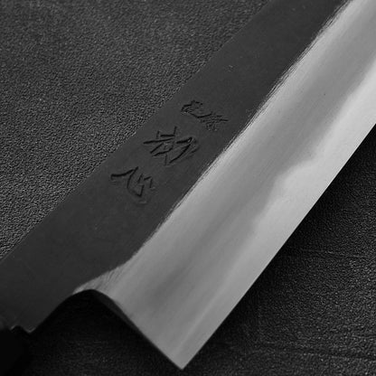 Close up view of the kanji of Hatsukokoro Yoake kurouchi aogami#1 kiritsuke gyuto knife