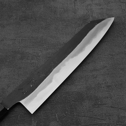 Close up view of the front side of Hatsukokoro Yoake kurouchi aogami#1 kiritsuke gyuto knife