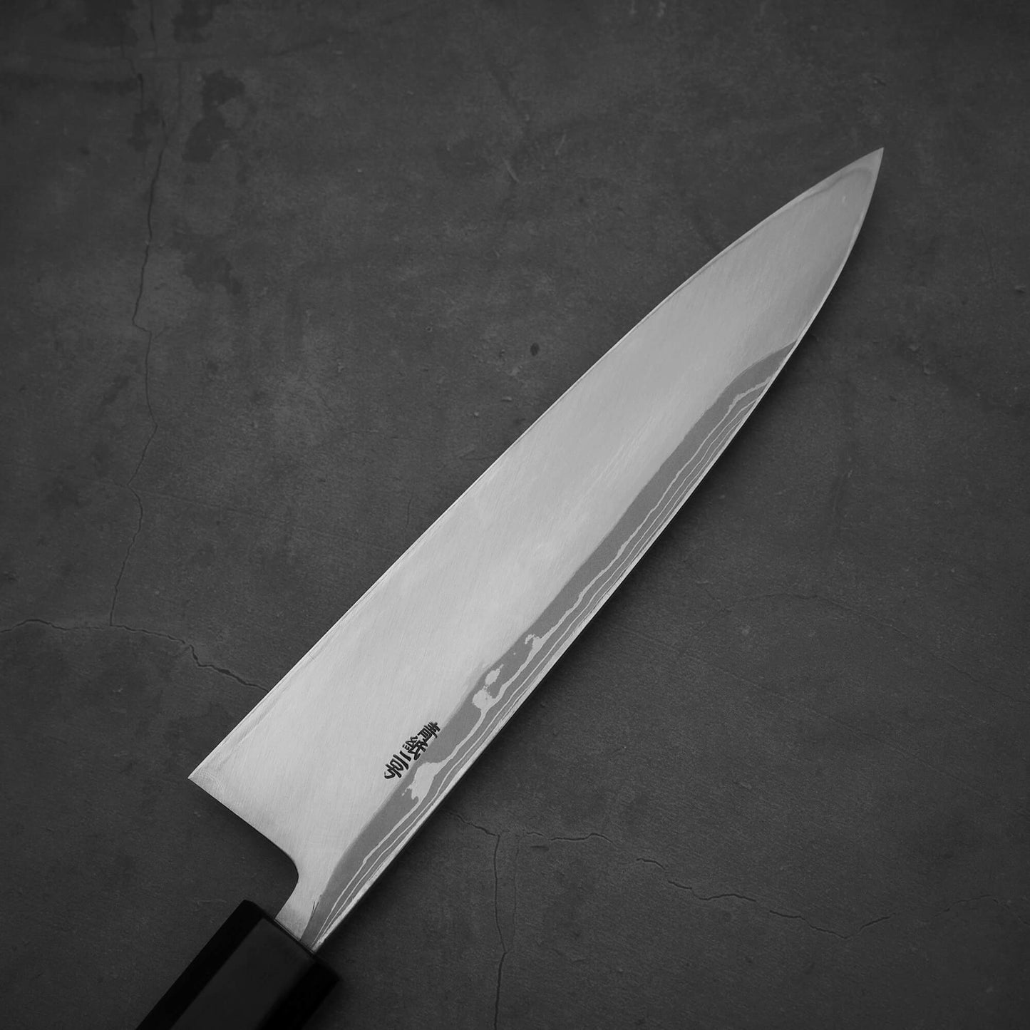 Top view of the left side of Hideo Kitaoka damascus aogami#2 mioroshi deba 210mm. 